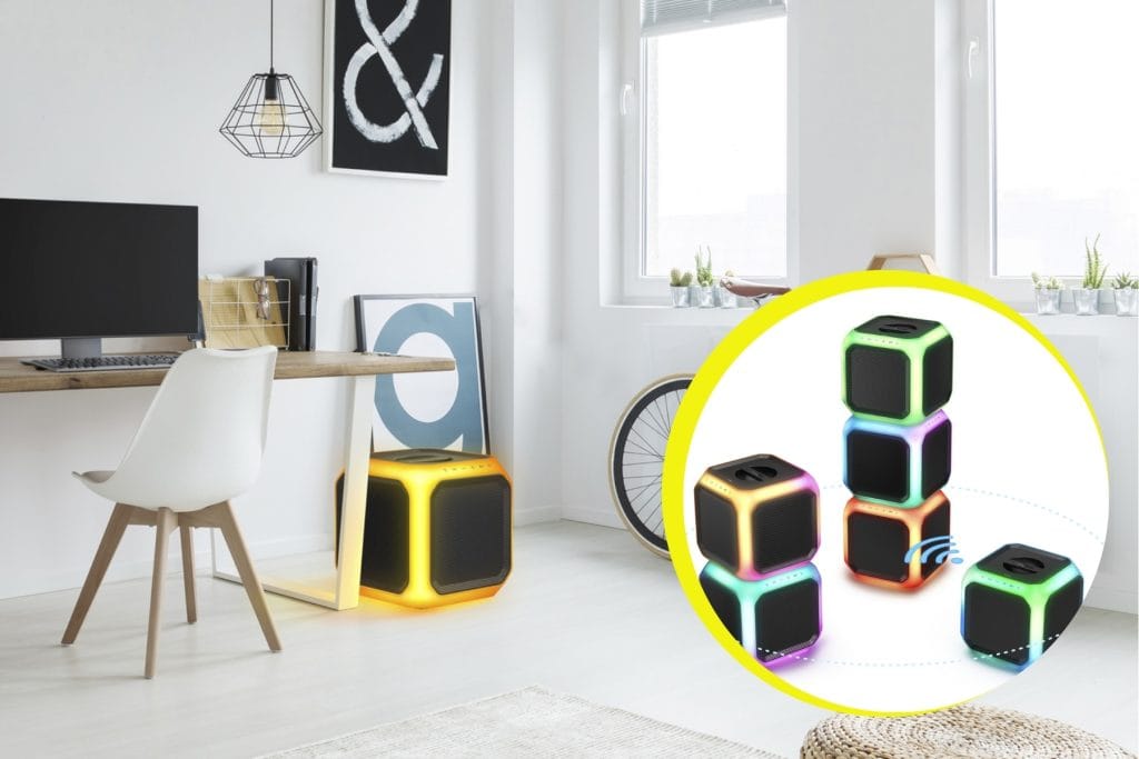 Philips TAX7207 party speaker with 360-degree glowing light bars in a room setting